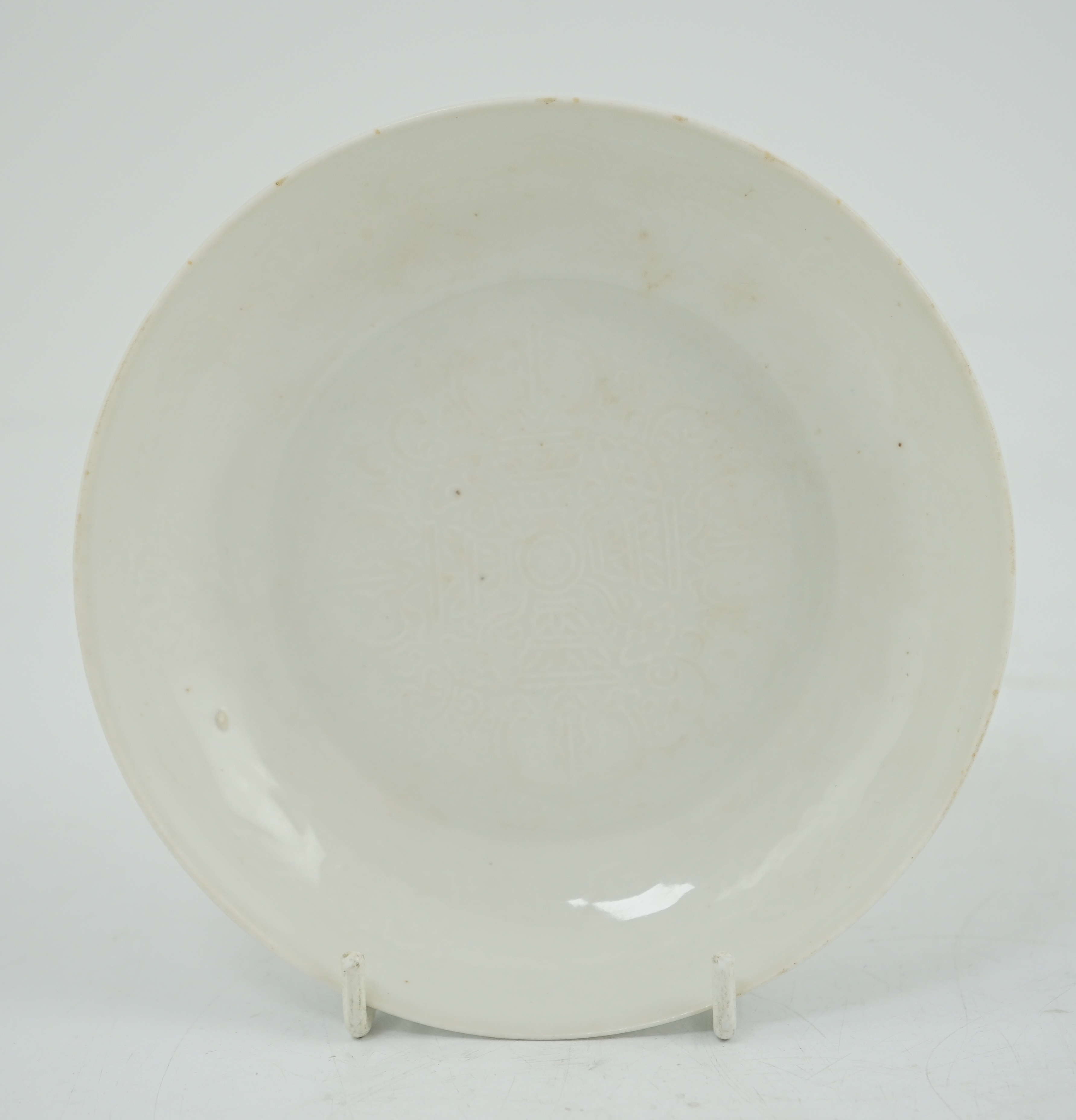 A Chinese moulded white glazed saucer dish, Yongle mark, Republic period